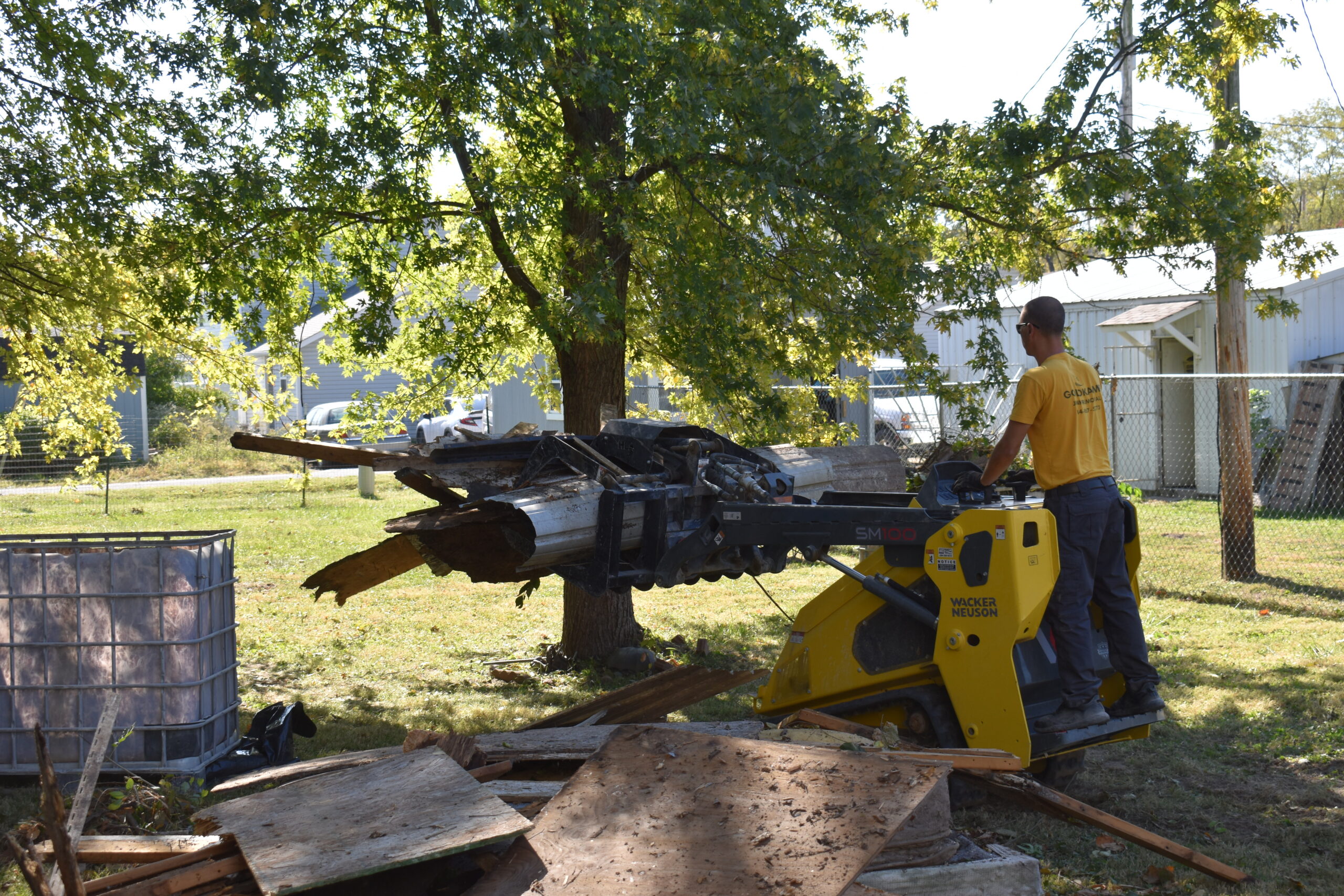 Crew from Goldkamp Junk Removal clearing debris and overgrowth during professional land clearing service in Troy, Missouri.